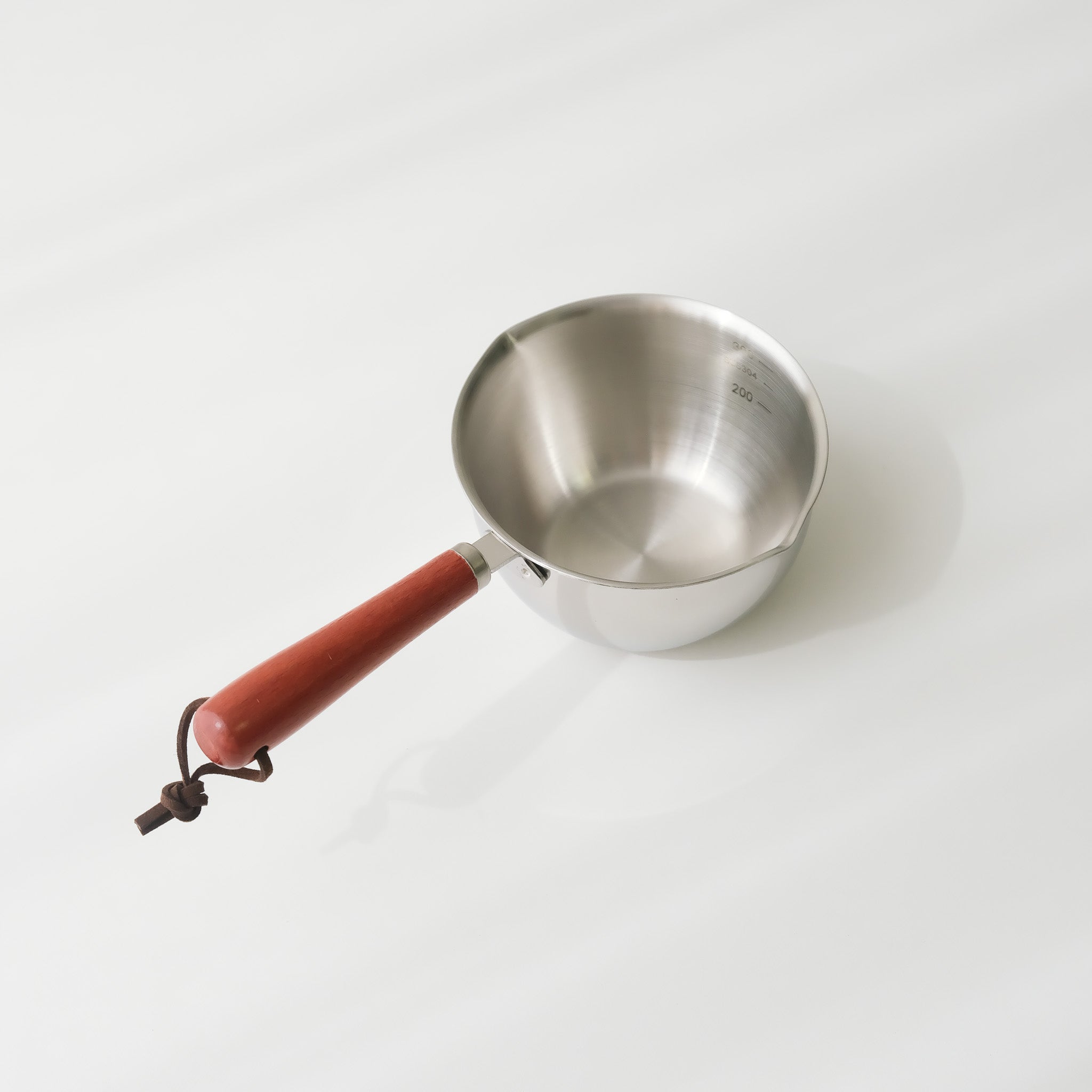 Wood handle milk pan